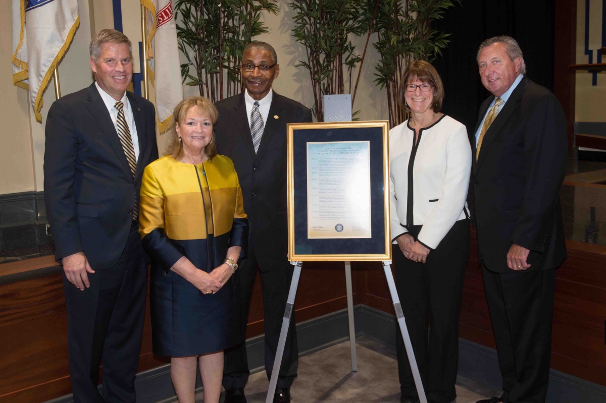 Pitt’s Board of Trustees passed a resolution naming the Livingston Alexander House, Residence Hall at the University of Pittsburgh at Bradford in honor of the president of Pitt–Bradford and Pitt–Titusville.  Pictured, from left: Pitt Chancellor Patrick Gallagher; Eva Tansky Blum, chairperson of Pitt’s Board of Trustees; Livingston Alexander; Jeannine T. Schoenecker, a University trustee and the incoming chair of the Pitt–Bradford Advisory Board; and Craig A. Hartburg, the current chair of the Pitt–Bradford Advisory Board and a former Pitt trustee.